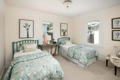 a bedroom with double bed and a window