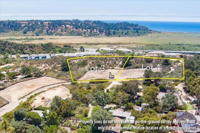 an aerial view of residential building with outdoor space and lake view