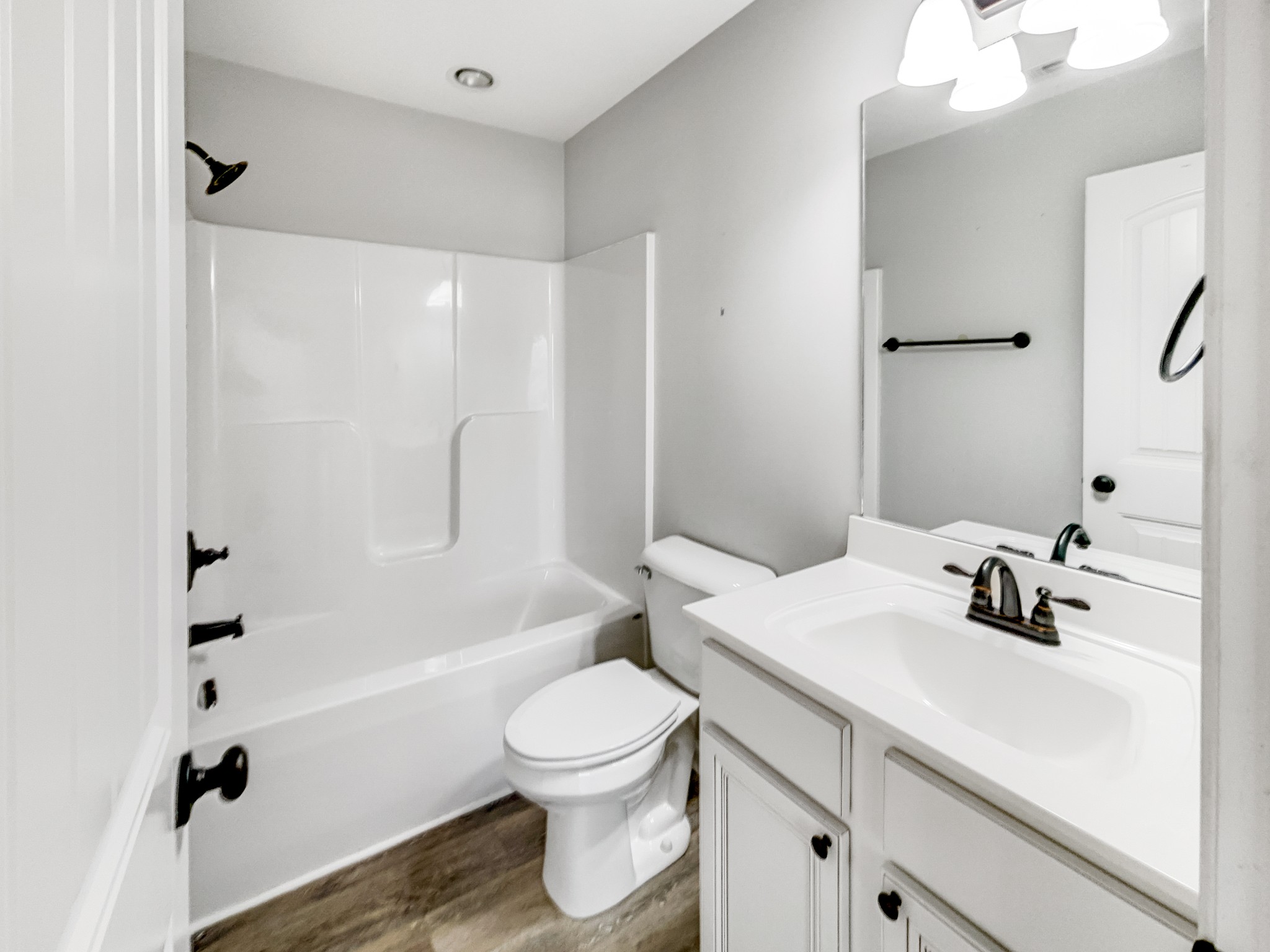 7689 South Swift Road Goodlettsville, TN 37072 - Photo 12 of 18 a bathroom with a sink a toilet and shower