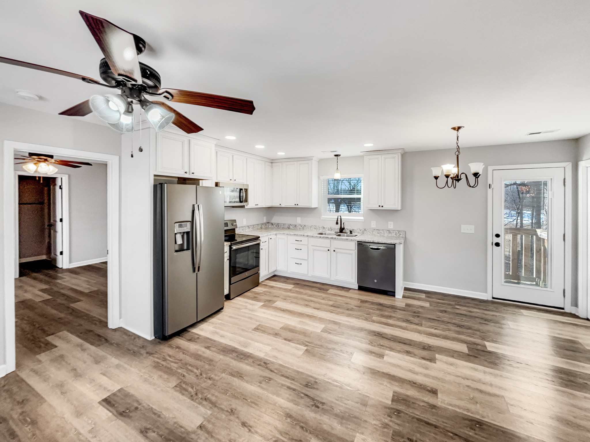 7689 South Swift Road Goodlettsville, TN 37072 - Photo 15 of 18 a kitchen with stainless steel appliances kitchen island a refrigerator sink and cabinets