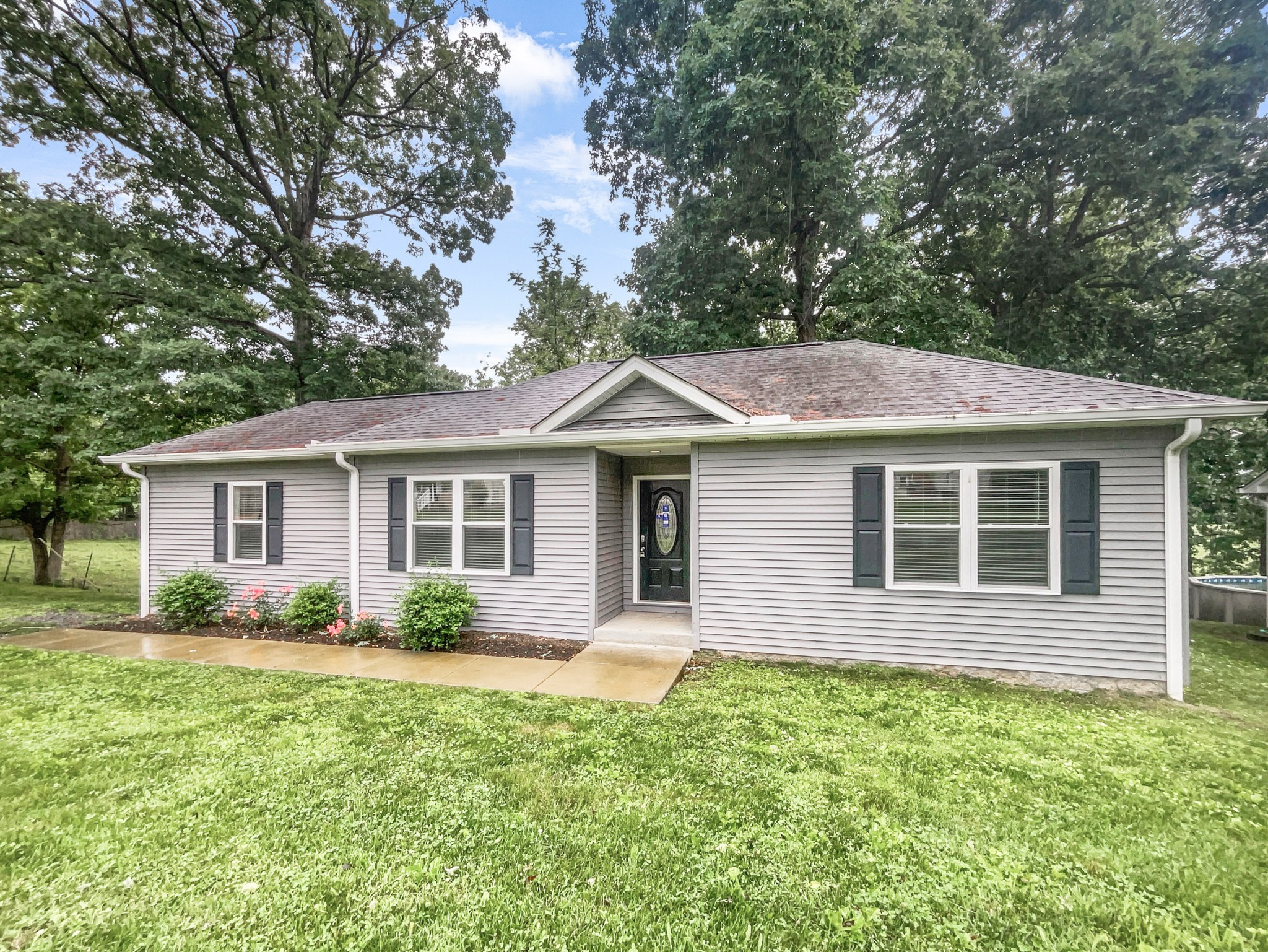 7689 South Swift Road Goodlettsville, TN 37072 - Photo 17 of 18 a front view of a house with garden