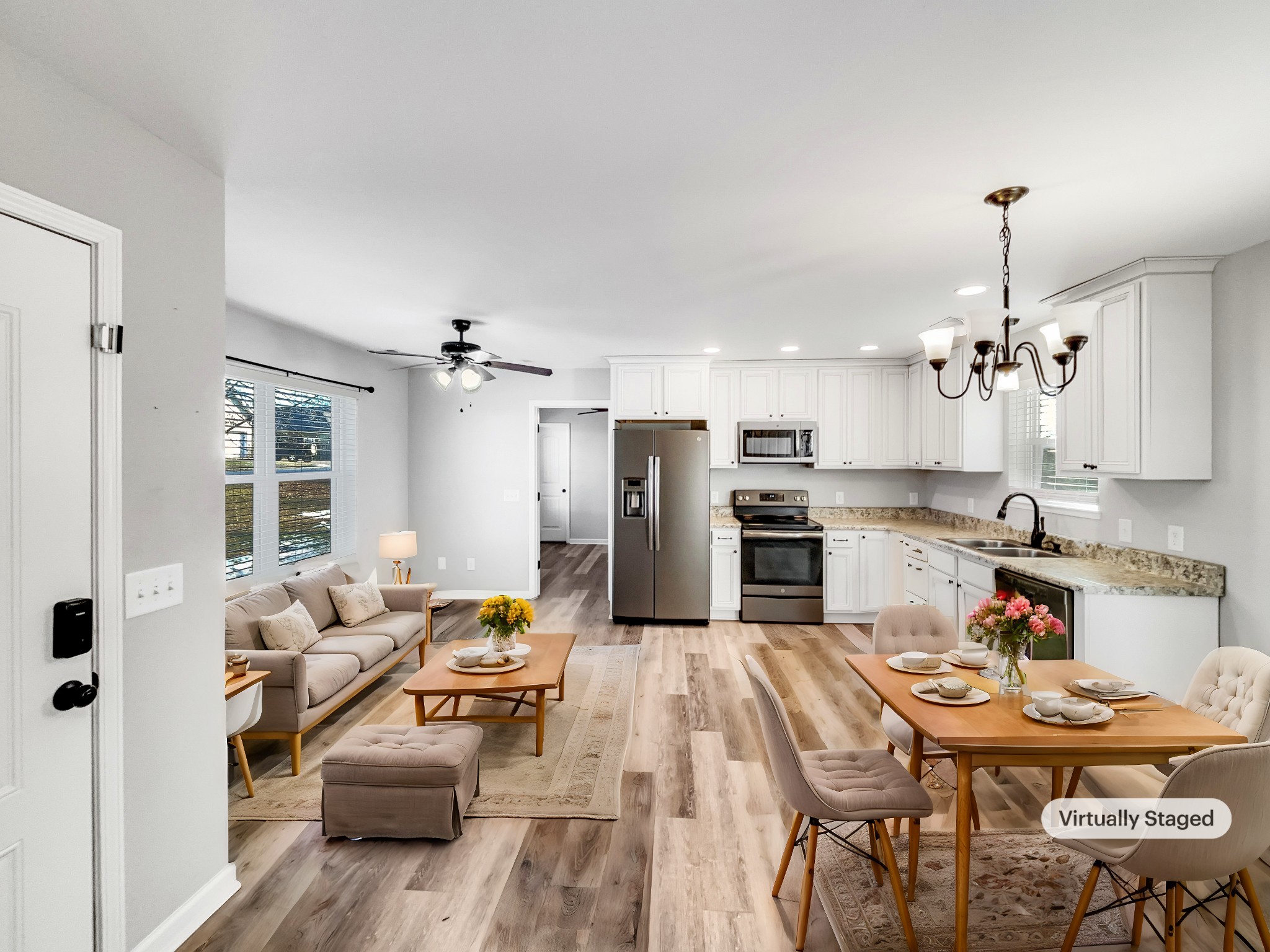 7689 South Swift Road Goodlettsville, TN 37072 - Photo 2 of 18 a living room with furniture kitchen view and a chandelier