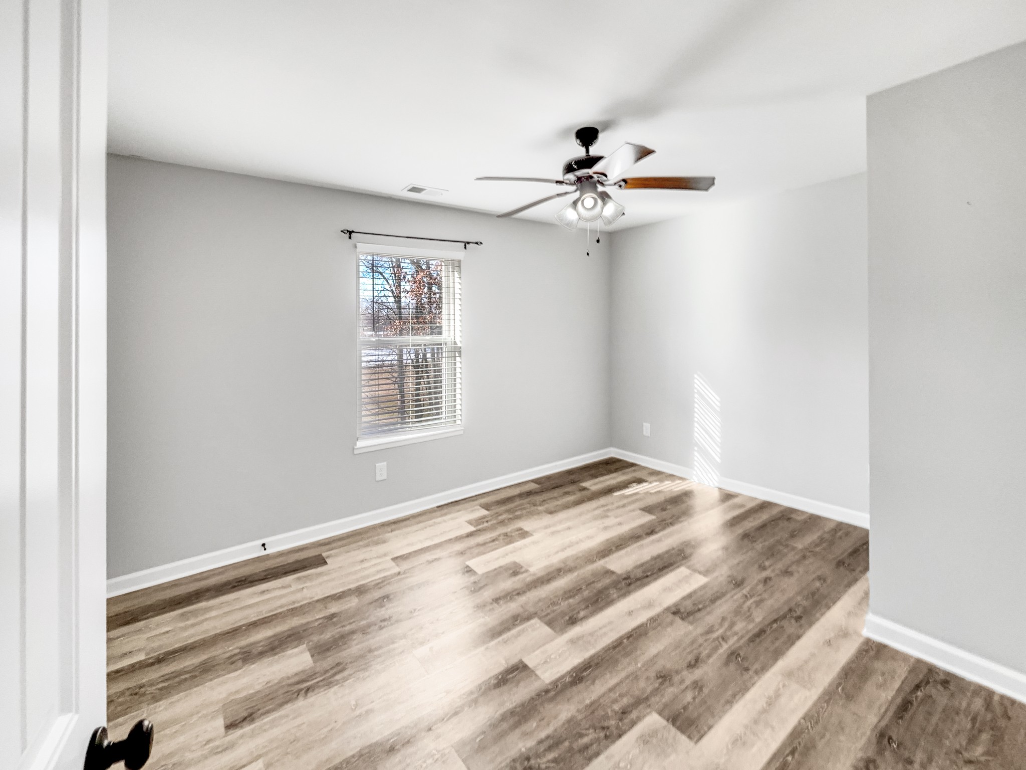 7689 South Swift Road Goodlettsville, TN 37072 - Photo 5 of 18 a view of empty room with wooden floor
