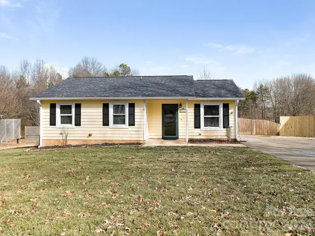 a house that has a big yard in front of it