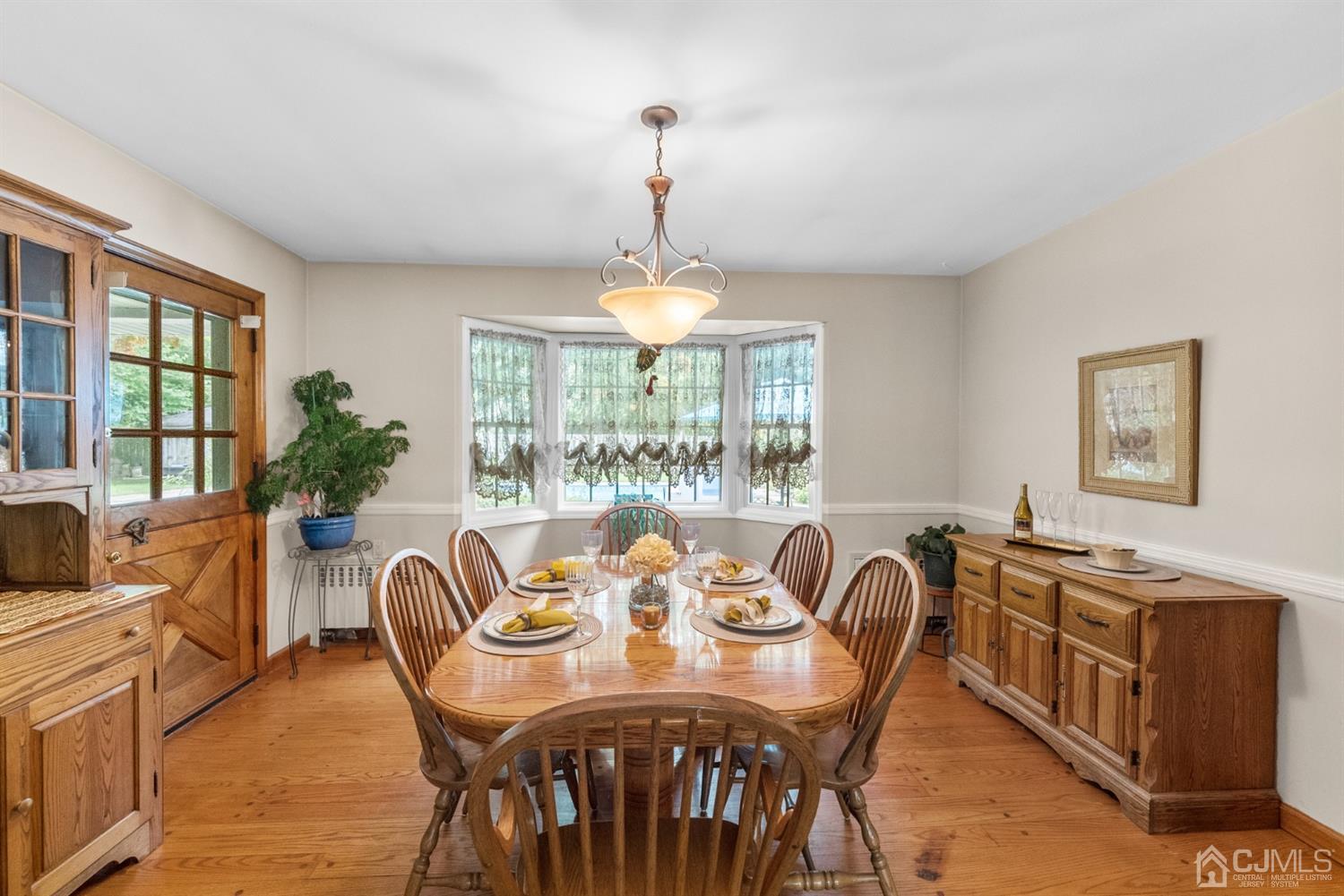 417 Ridge Road Dayton, NJ 08810 - Photo 11 of 37 a view of a dining room with furniture window and outside view