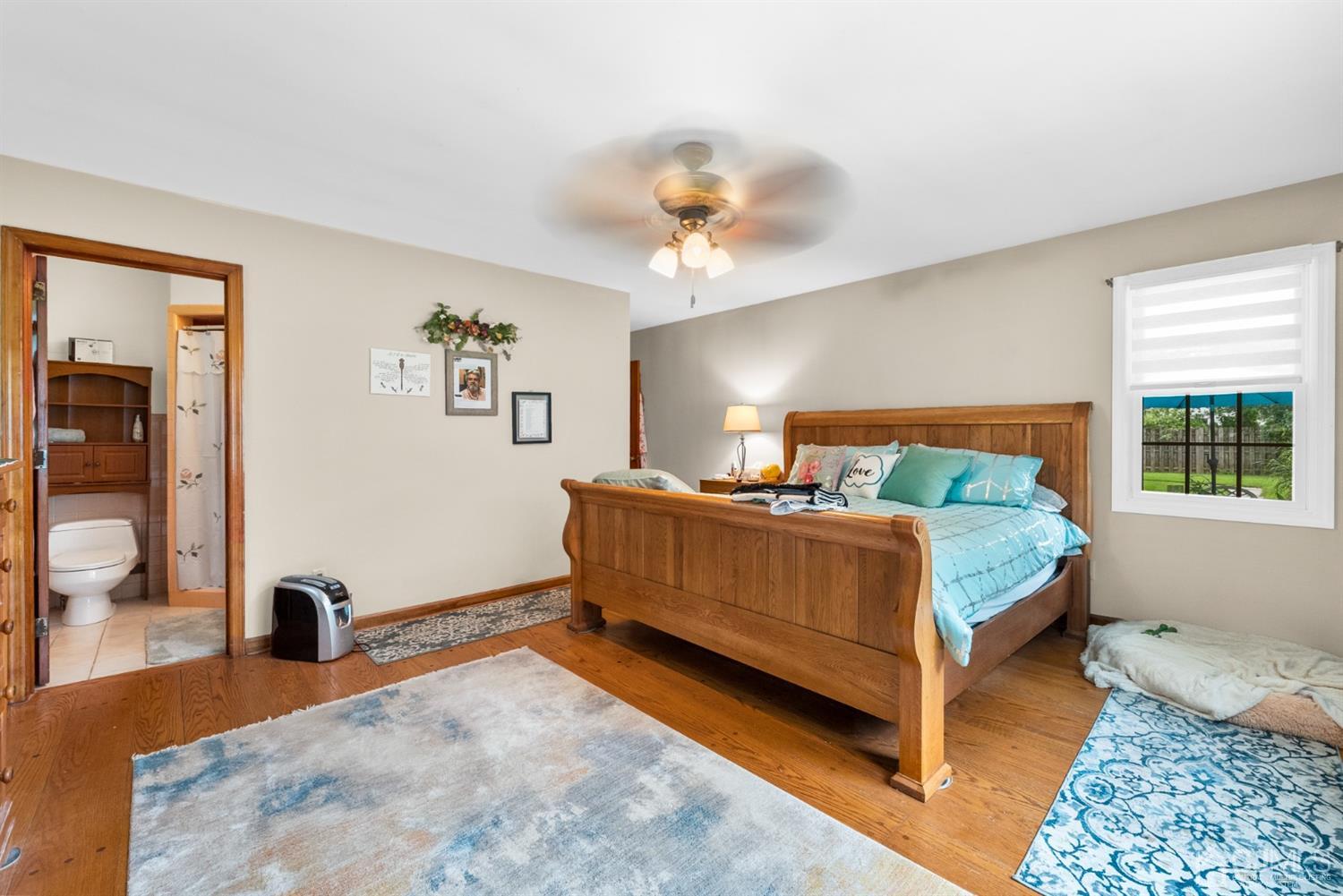 417 Ridge Road Dayton, NJ 08810 - Photo 18 of 37 a bedroom with a bed and a chandelier