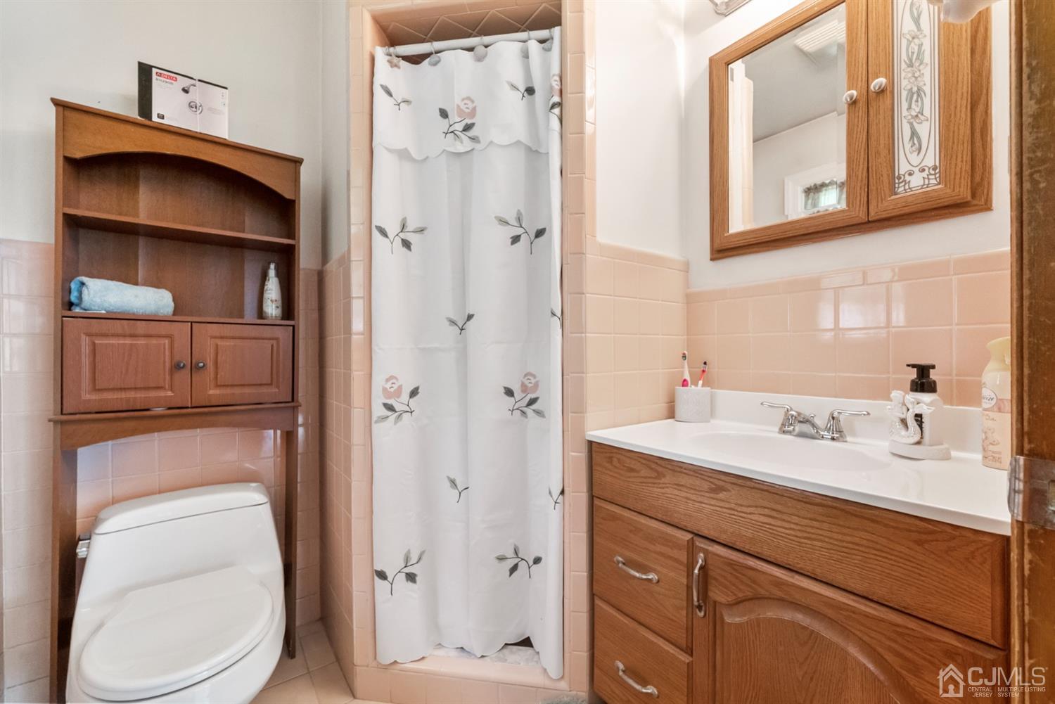 417 Ridge Road Dayton, NJ 08810 - Photo 19 of 37 a bathroom with a sink a toilet and vanity