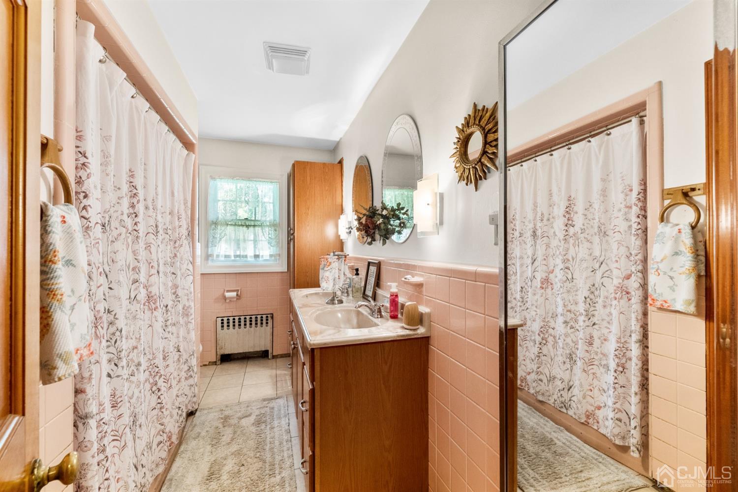 417 Ridge Road Dayton, NJ 08810 - Photo 23 of 37 a en suite bathroom with a sink a mirror and a shower