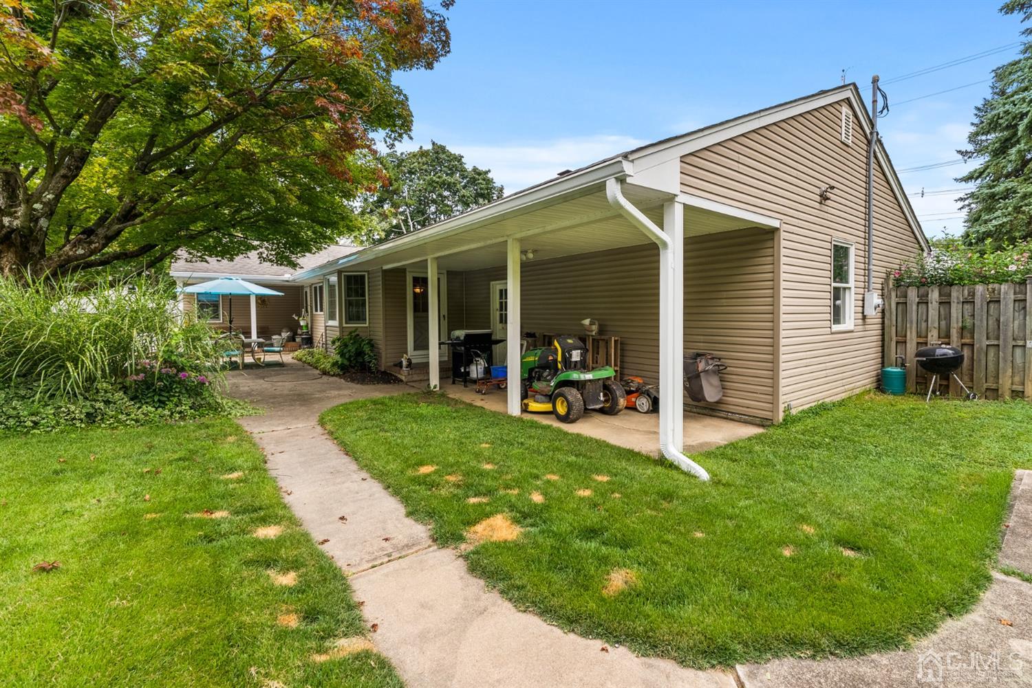 417 Ridge Road Dayton, NJ 08810 - Photo 35 of 37 a view of a house with a yard porch and sitting area