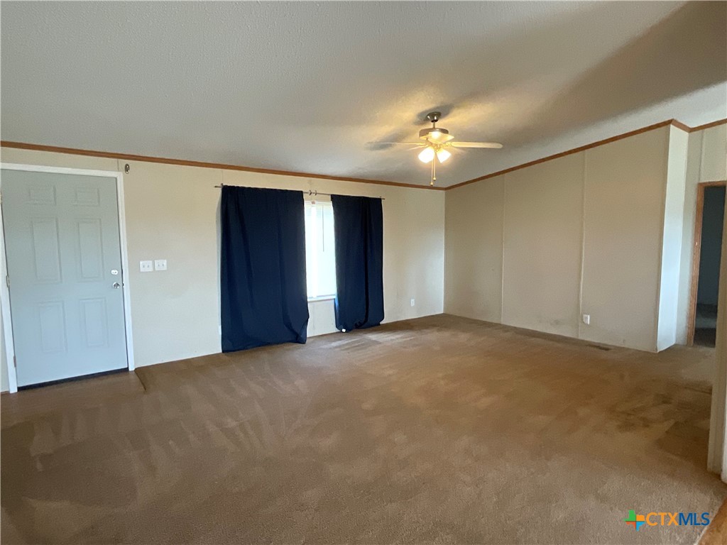 383 County Road 233 Hallettsville, TX 77964 - Photo 11 of 48 a view of an empty room with a ceiling fan