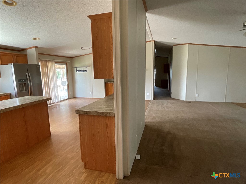 383 County Road 233 Hallettsville, TX 77964 - Photo 18 of 48 a view of a kitchen from the hallway