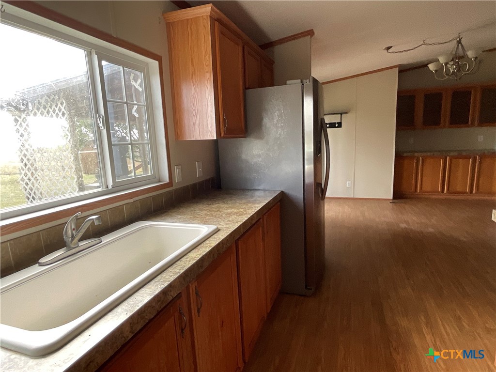 383 County Road 233 Hallettsville, TX 77964 - Photo 20 of 48 a kitchen with a sink and a large window