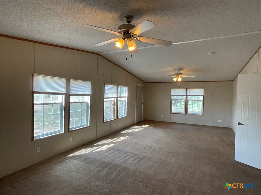 383 County Road 233 Hallettsville, TX 77964 - Photo 6 of 48 a view of an empty room with a window