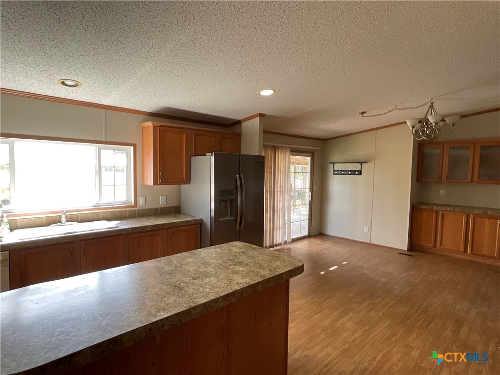 383 County Road 233 Hallettsville, TX 77964 - Photo 8 of 48 a view of a kitchen with stainless steel appliances granite countertop a refrigerator and a stove