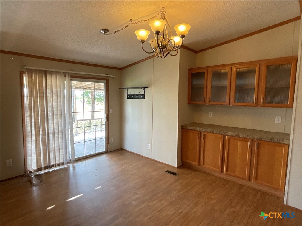 383 County Road 233 Hallettsville, TX 77964 - Photo 10 of 48 wooden floor in an empty room with a window