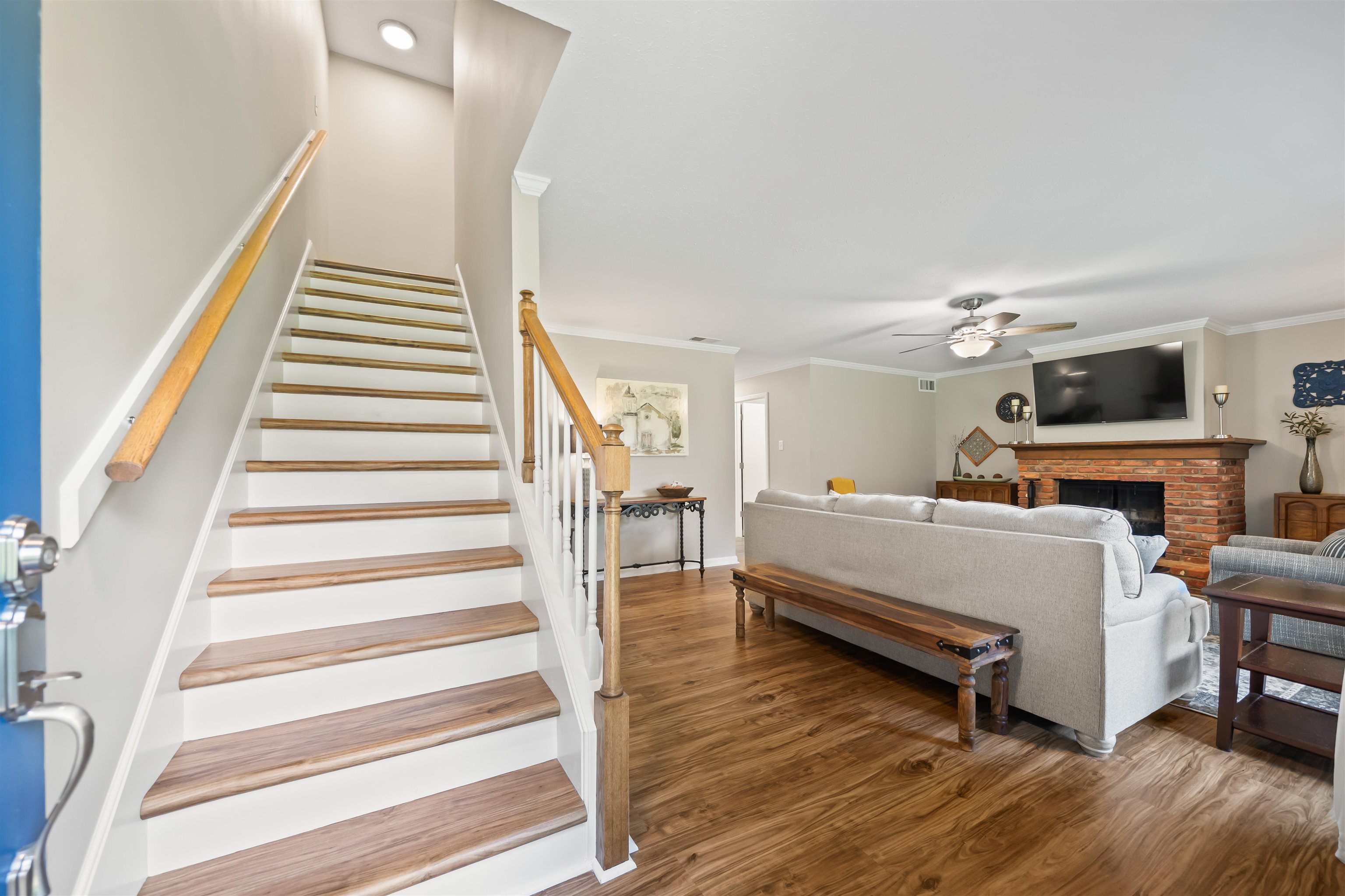 6943 Fords Station Road, Unit 64 Germantown, TN 38138 - Photo 5 of 30 Staircase with wood-finish treads and white risers, featuring a wood handrail
