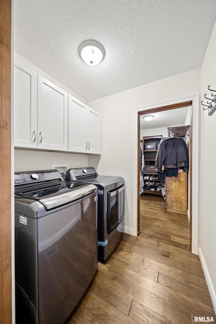 300 2nd Avenue Hampton, IL 61256 - Photo 16 of 32 a kitchen with a stove and a view of living room