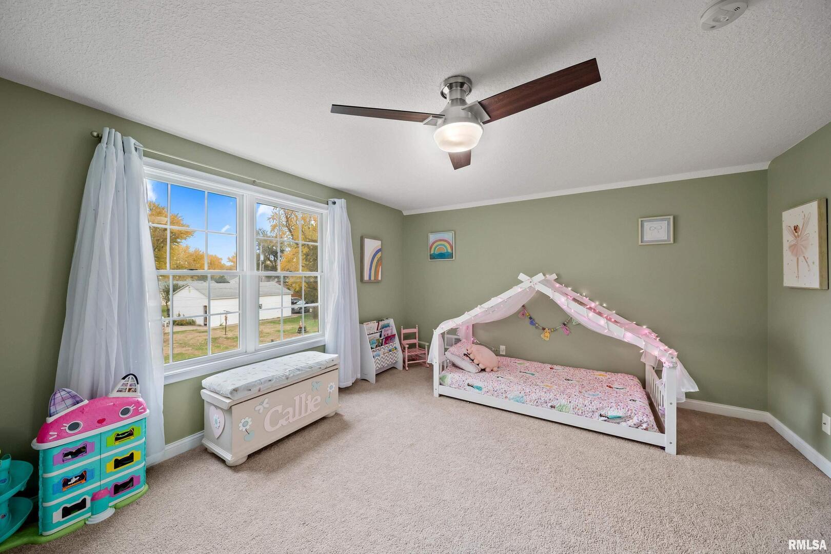 300 2nd Avenue Hampton, IL 61256 - Photo 19 of 32 a living room with furniture and a window