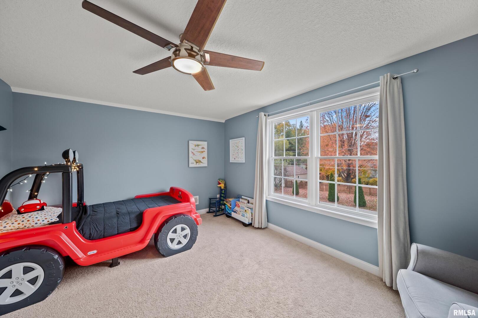 300 2nd Avenue Hampton, IL 61256 - Photo 20 of 32 a bedroom with a bed and a window