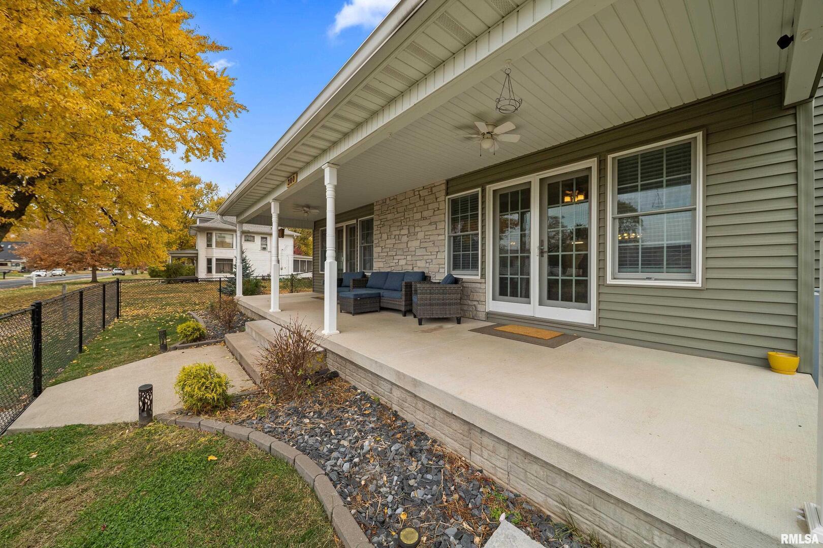 300 2nd Avenue Hampton, IL 61256 - Photo 2 of 32 a front view of a house with garden