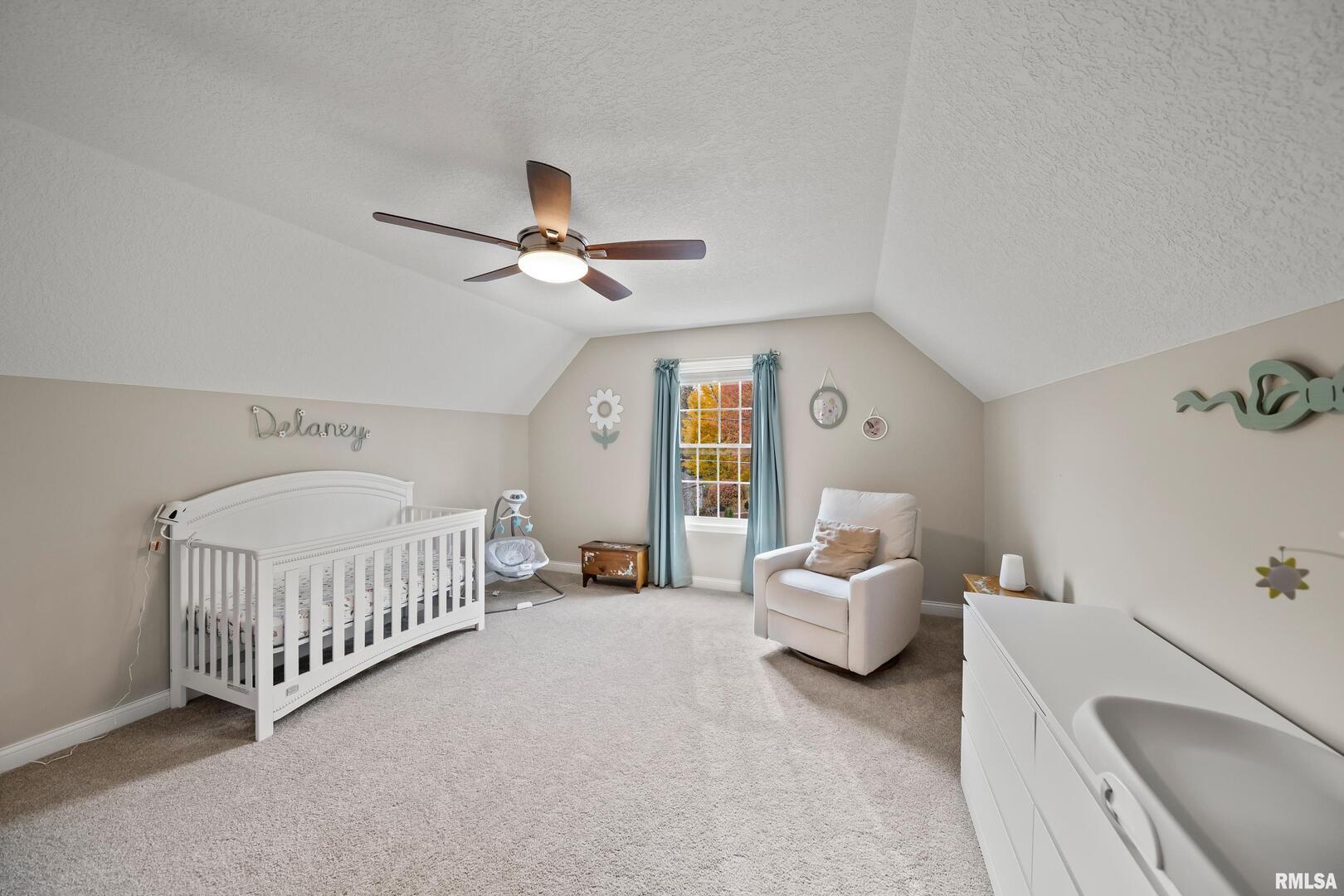 300 2nd Avenue Hampton, IL 61256 - Photo 24 of 32 a bedroom with furniture and a window