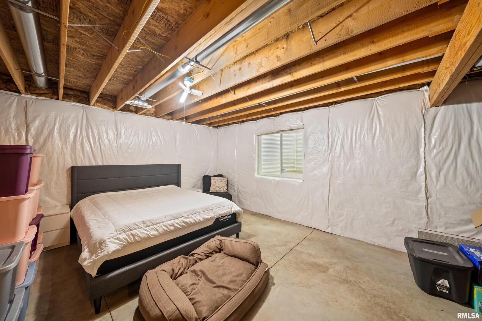 300 2nd Avenue Hampton, IL 61256 - Photo 25 of 32 a bedroom with a bed and a couch