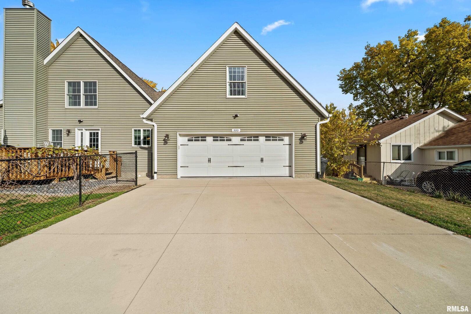 300 2nd Avenue Hampton, IL 61256 - Photo 26 of 32 a view of house with outdoor space and parking