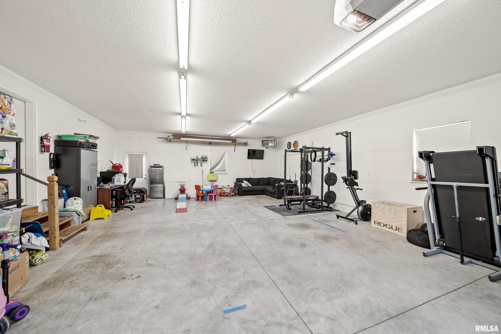 300 2nd Avenue Hampton, IL 61256 - Photo 27 of 32 a view of a room with gym equipment