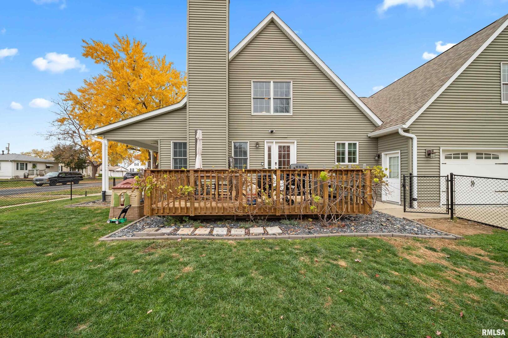 300 2nd Avenue Hampton, IL 61256 - Photo 31 of 32 a view of a house with a yard and deck