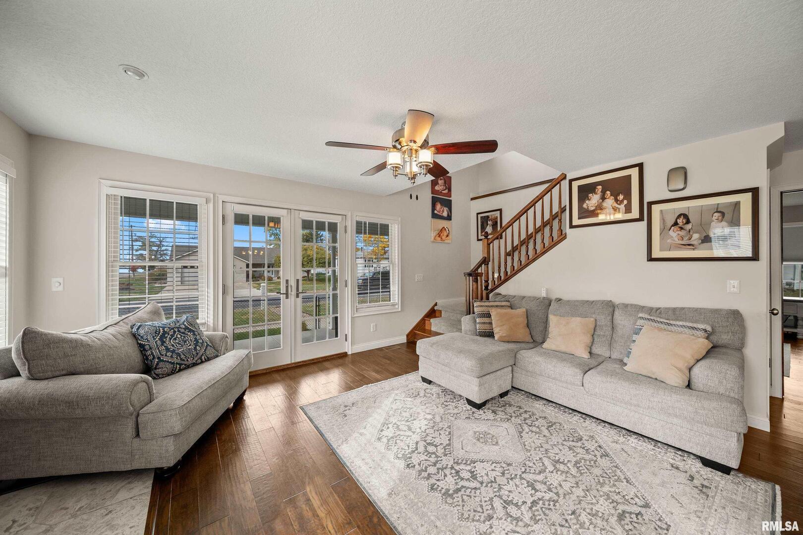 300 2nd Avenue Hampton, IL 61256 - Photo 9 of 32 a living room with furniture and a large window
