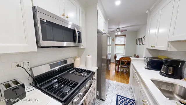 a kitchen with a stove and a microwave