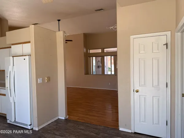 a view of a hallway with front door