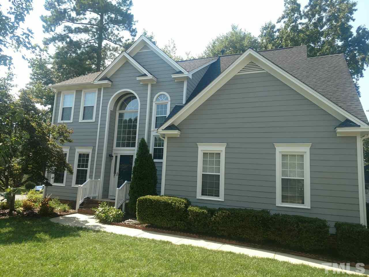 12101 Amoretto Way Raleigh, NC 27613 - Photo 1 of 15 a front view of a house with a yard