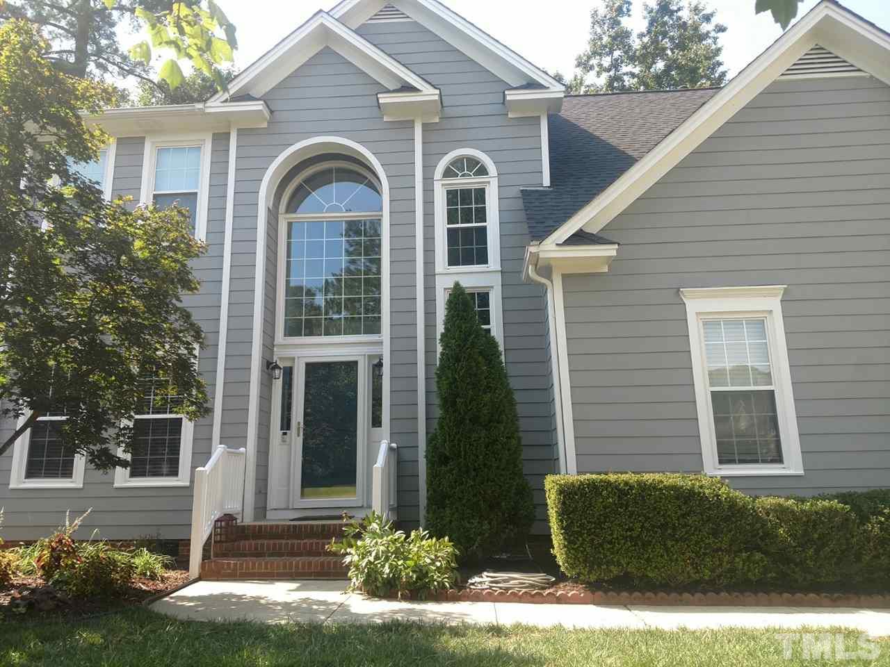 12101 Amoretto Way Raleigh, NC 27613 - Photo 14 of 15 a front view of a house with garden