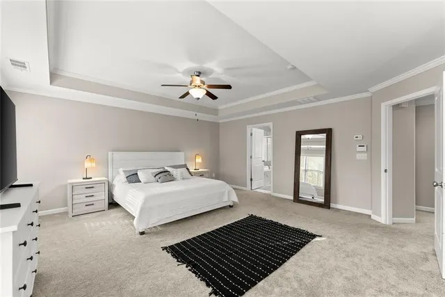 a bedroom with a bed couch and window