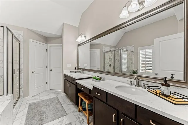 a spacious bathroom with a tub and shower