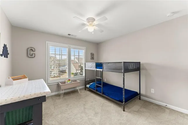 a en suite bathroom with a double vanity sink and a mirror