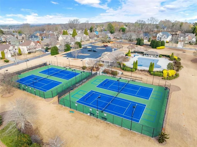 an aerial view of a house with outdoor space