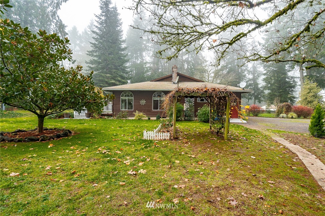 180 Winter Road Winlock, WA 98596 - Photo 2 of 40 a view of a house with a yard patio and tree