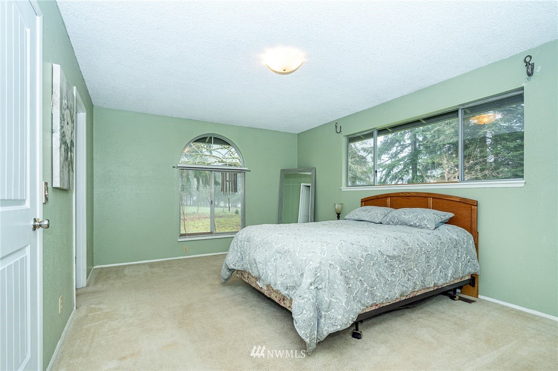 180 Winter Road Winlock, WA 98596 - Photo 12 of 40 a bedroom with a bed and window