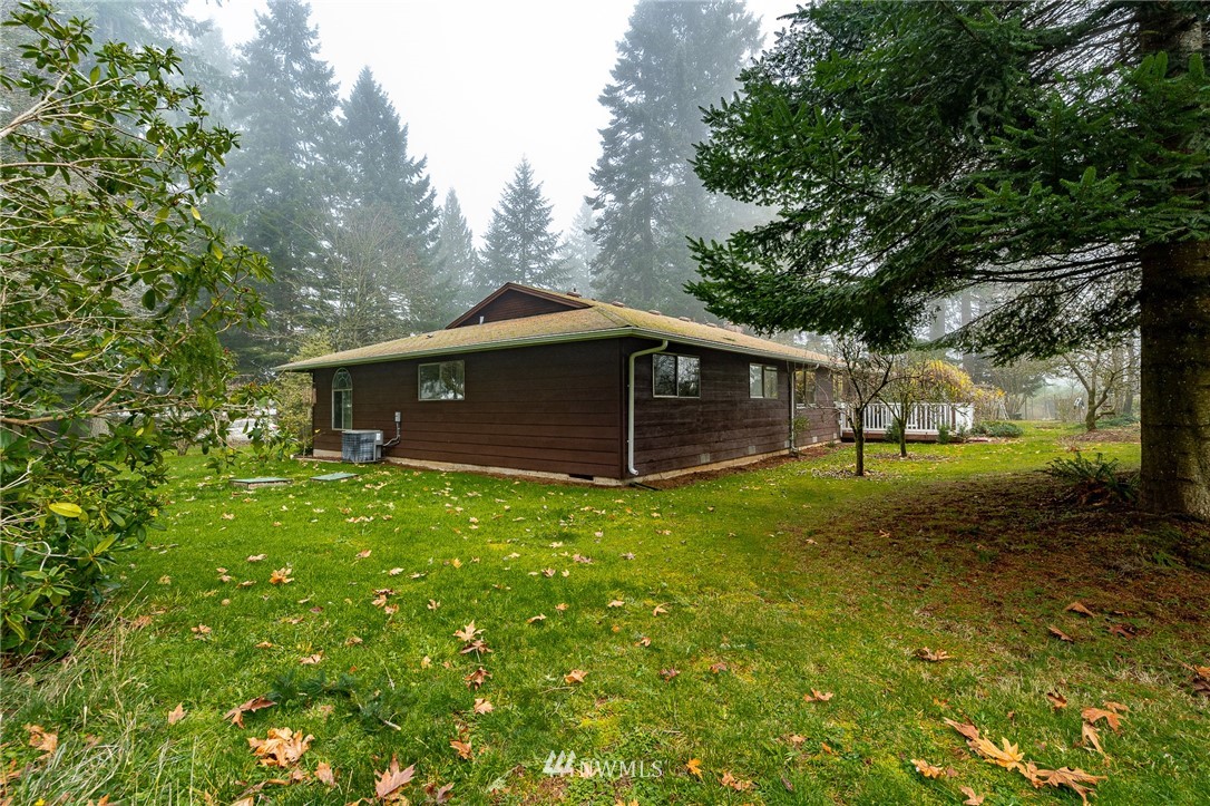 180 Winter Road Winlock, WA 98596 - Photo 30 of 40 a view of a house with a backyard