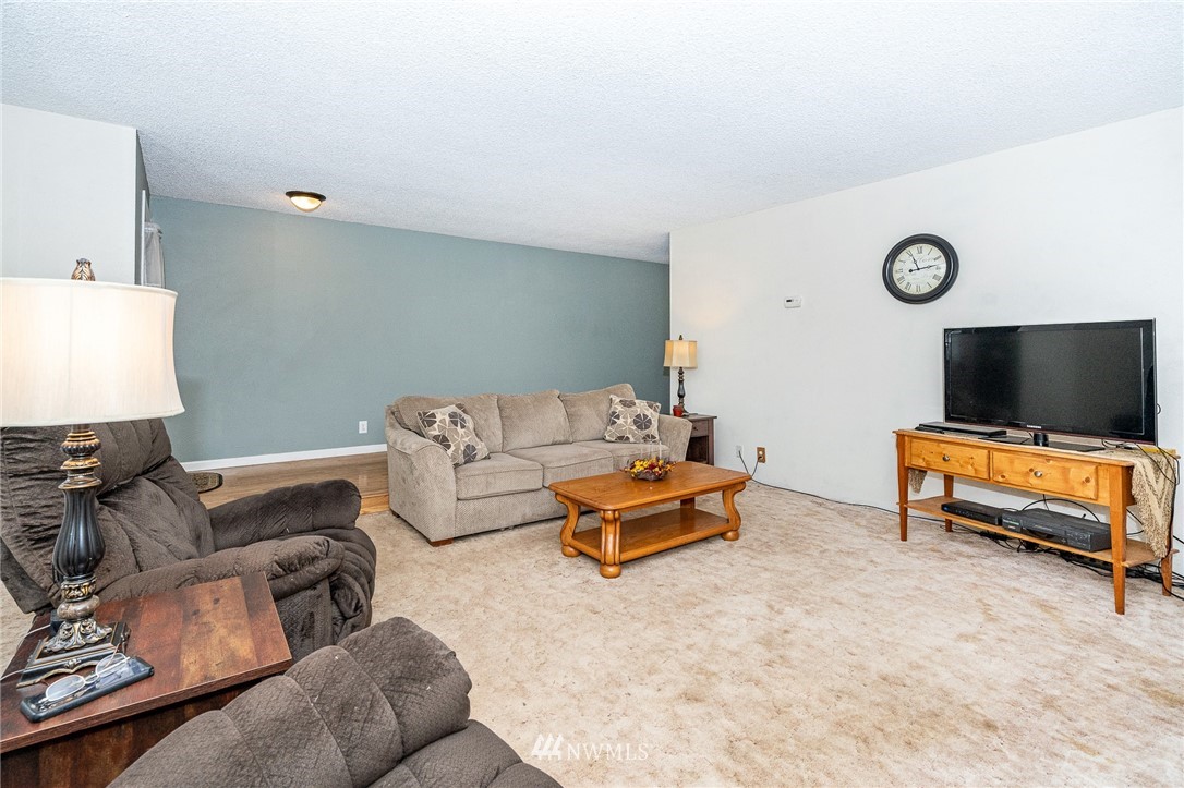 180 Winter Road Winlock, WA 98596 - Photo 4 of 40 a living room with furniture and a flat screen tv