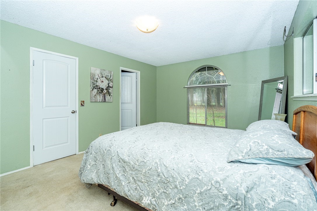 180 Winter Road Winlock, WA 98596 - Photo 40 of 40 a bedroom with a bed and a window