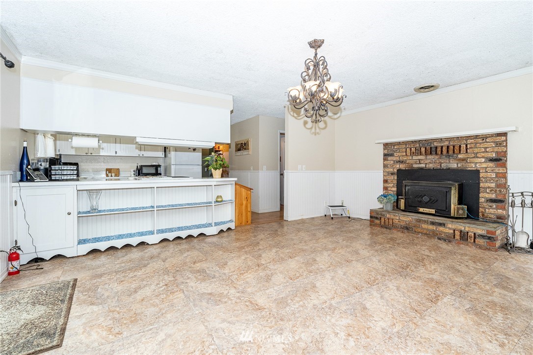 180 Winter Road Winlock, WA 98596 - Photo 5 of 40 a view of a livingroom with a fireplace and a window
