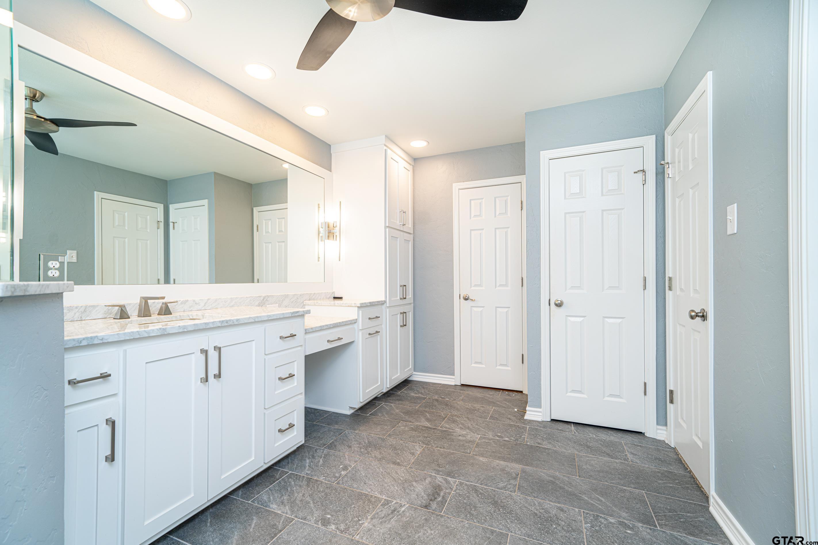 1704 West Northwood Court Longview, TX 75605 - Photo 13 of 32 a bathroom with a granite countertop sink mirror and