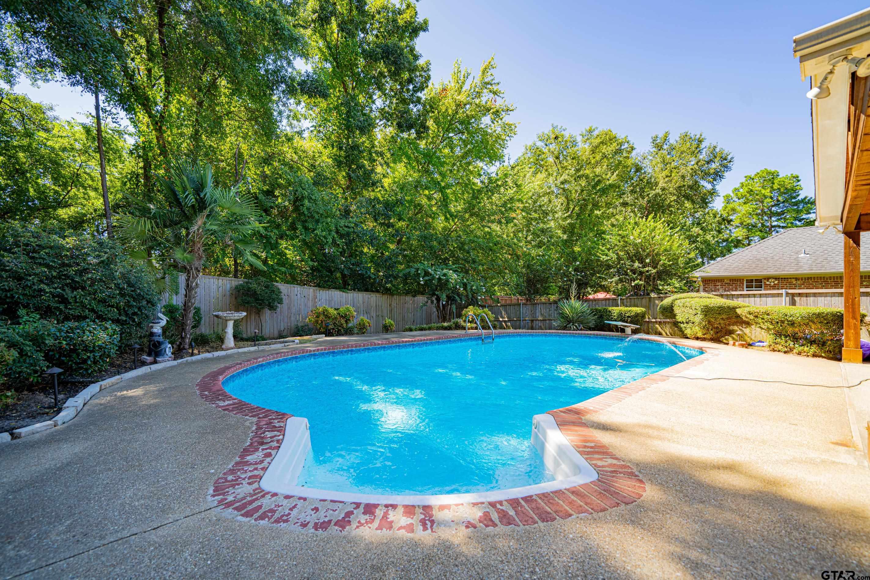 1704 West Northwood Court Longview, TX 75605 - Photo 26 of 32 a view of a swimming pool with an outdoor space