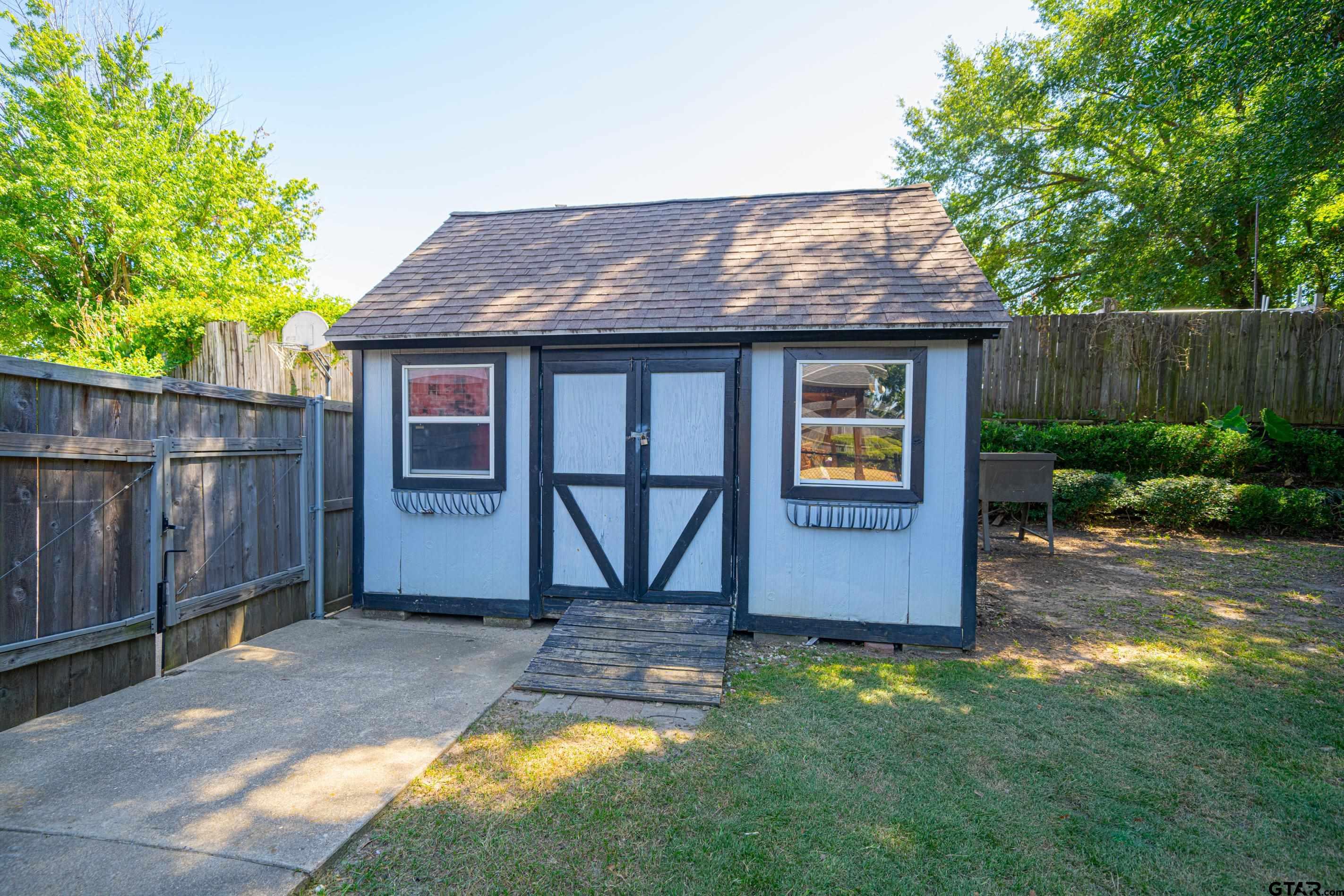 1704 West Northwood Court Longview, TX 75605 - Photo 27 of 32 a view of outdoor space yard and deck