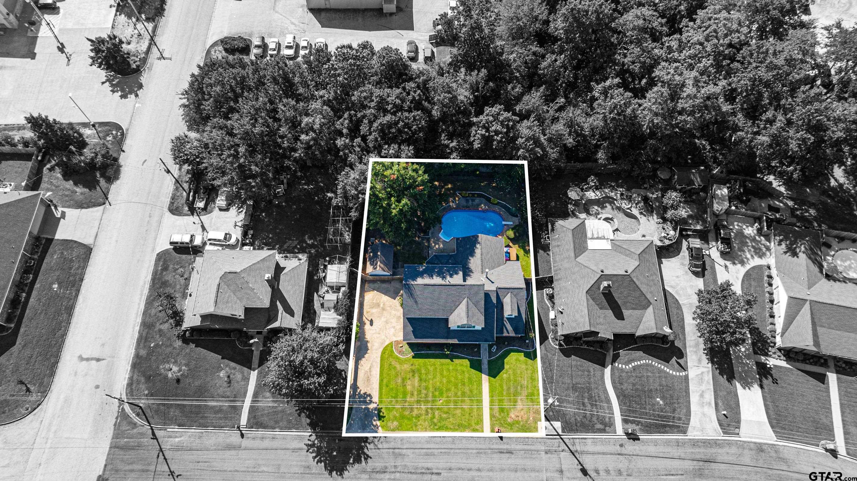 1704 West Northwood Court Longview, TX 75605 - Photo 32 of 32 an aerial view of a house with a swimming pool