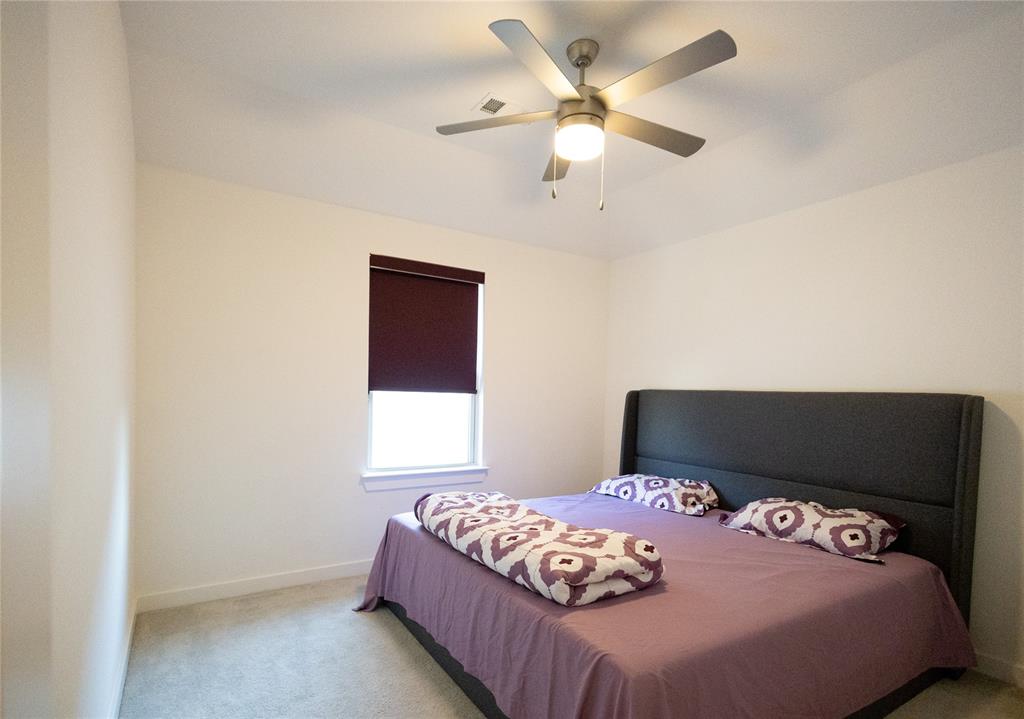 3017 Andorra Road McKinney, TX 75071 - Photo 34 of 40 Recessed window with privacy roller shade, ceiling fan with integrated lighting, and carpeted flooring