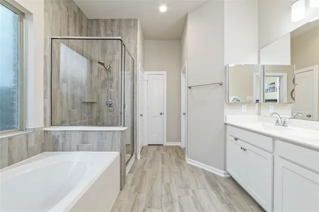 a bathroom with a bathtub and a sink